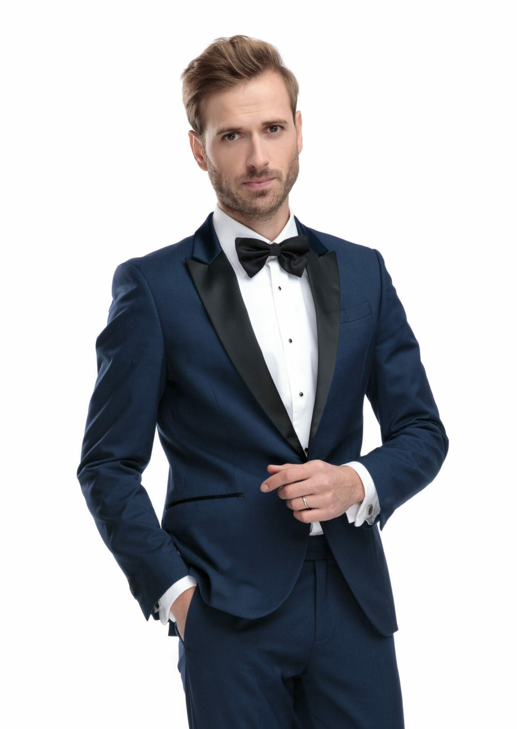 A handsome young man poses wearing a Navy Venice tuxedo rental.